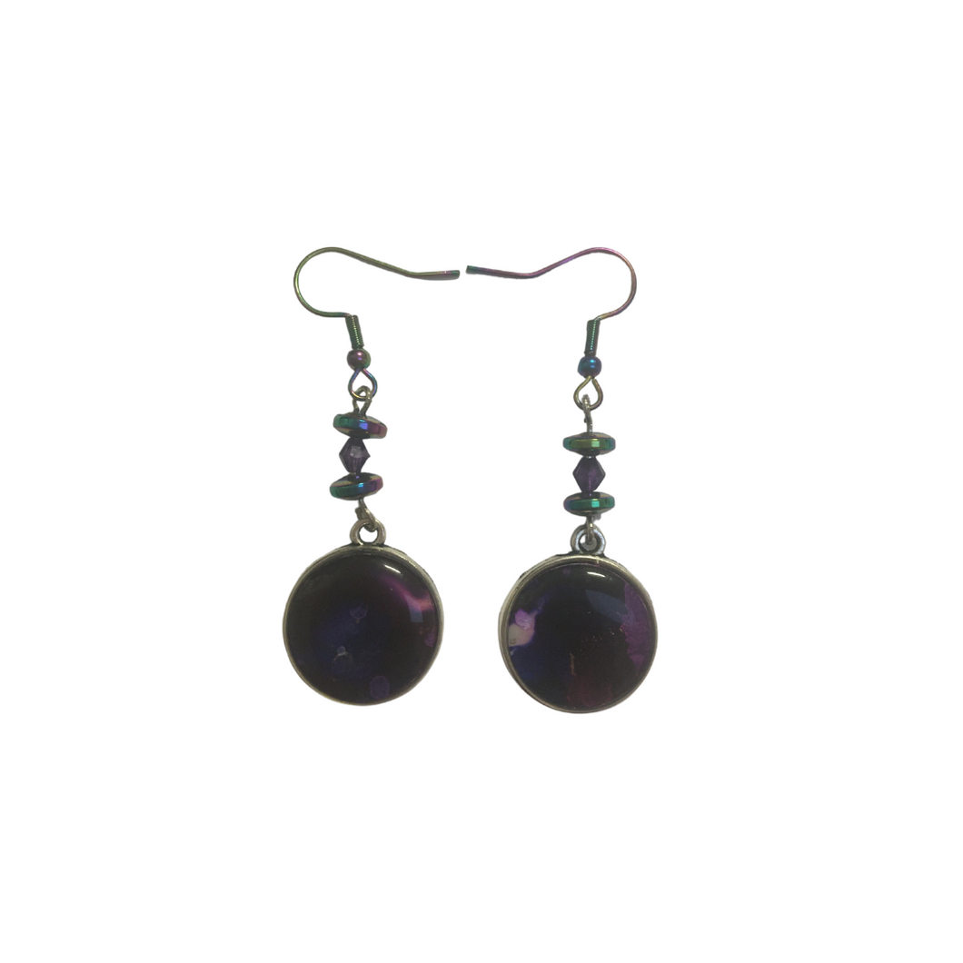 Purple earrings in silver settings