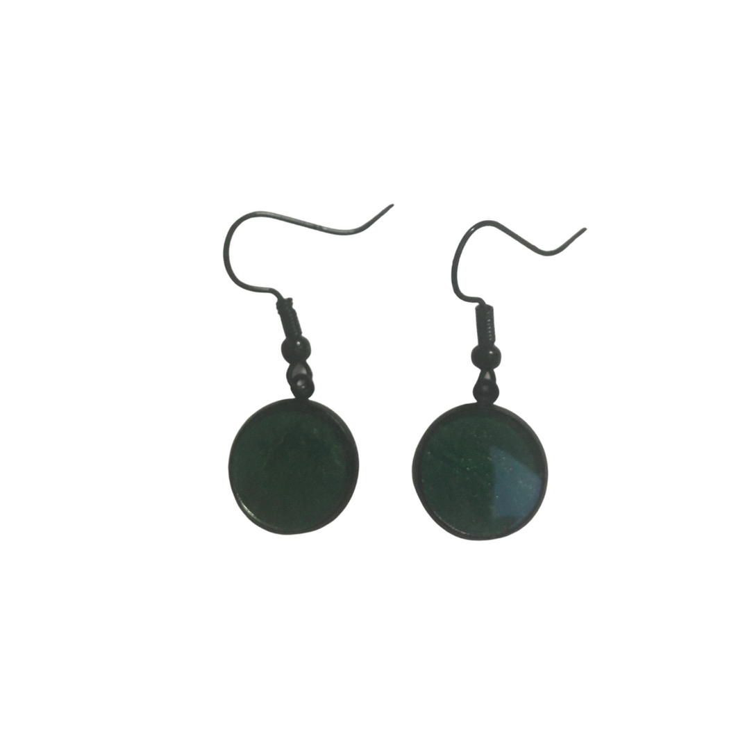 Green earrings in black settings